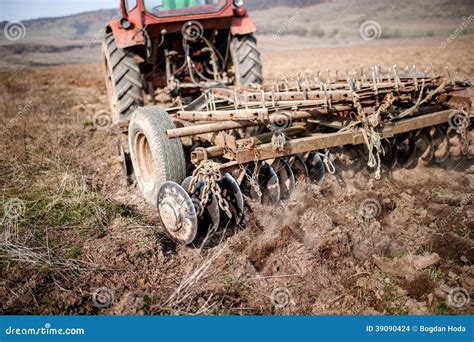 Vintage Tractor Plowing The Field Stock Photo - Image: 39090424