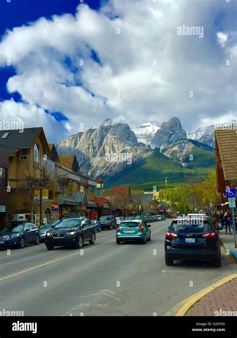 Downtown Canmore, Alberta, Canada, Main Street and the Canadian Rockies Stock Photo - Alamy