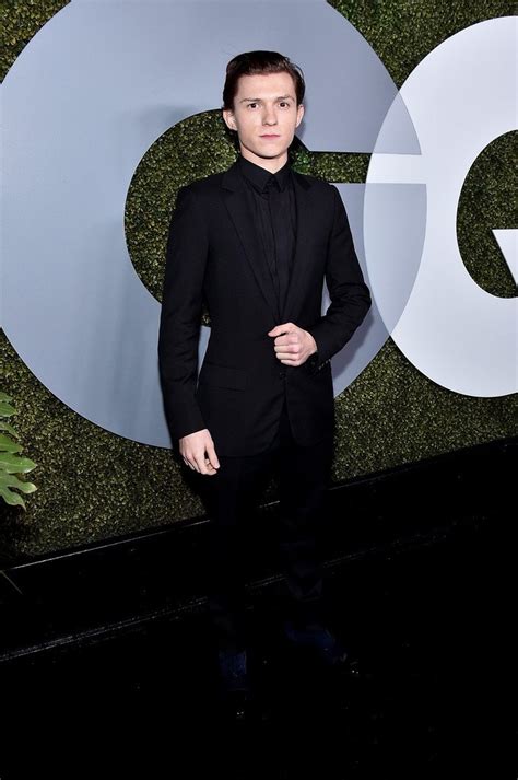 Tom Holland wore a DiorHomme black suit to the 2016 GQ Men of the Year ...