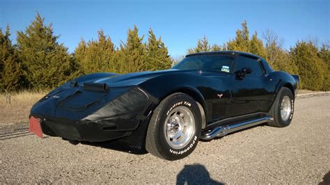 1979 corvette black on black with chrome sidepipes