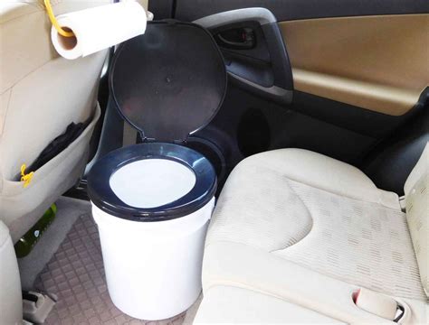 A bucket toilet inside of an SUV | Suv camping, Suv camper, Subaru forester