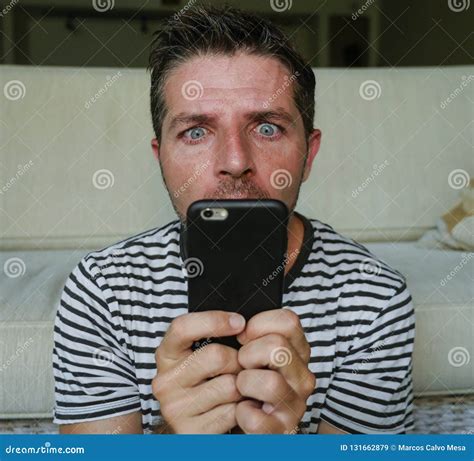 Young Weird And Crazy Mobile Phone Addict Man Using Cell Compulsively ...