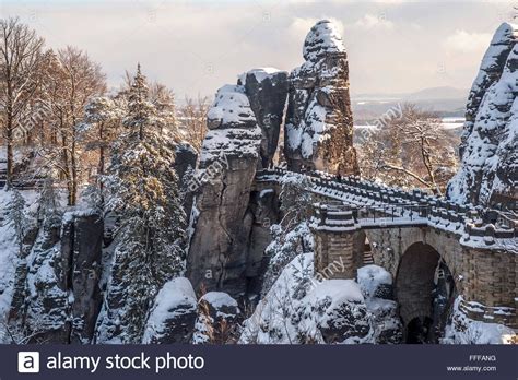 Bastei bridge in Saxon Switzerland in winter time, covered with snow Stock Photo, Royalty Free ...