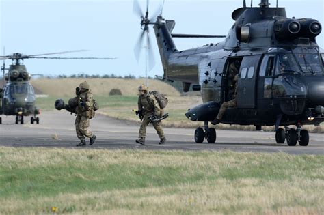 Troops from 16 Air Assault Brigade insert into Kinloss Airfield by Puma 2 helicopters during ...
