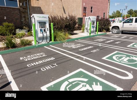 EV Electric Vehicle Charging Stations and parking spots at the front of ...