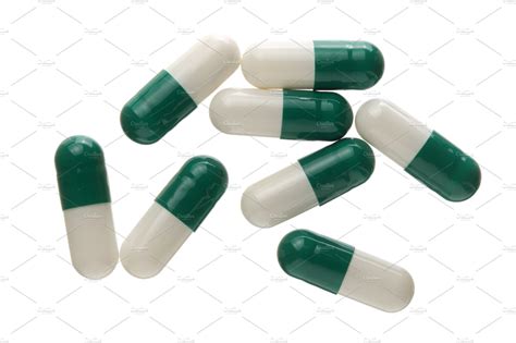 White and green pill capsule isolated on white background top view flat lay | Health & Medical ...