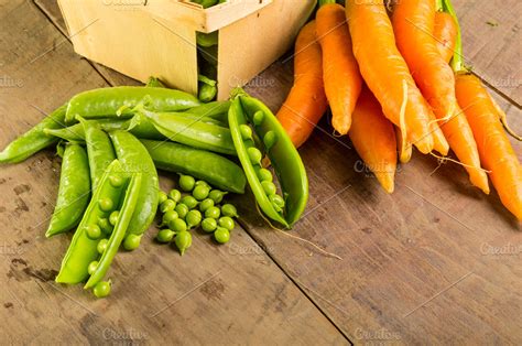 Fresh peas and carrots | High-Quality Food Images ~ Creative Market