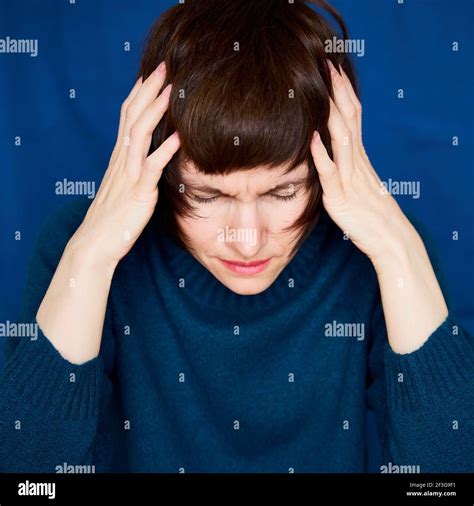 Portrait of mature woman in distress, close-up. Agitated tensed face ...