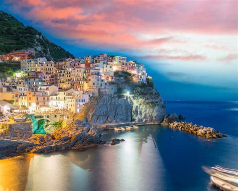 Sunset Over Manarola with Boat Approaching, Five Lands Stock Photo ...