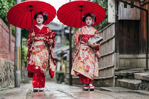 Maiko geisha walking on a street of Gion in Kyoto Japan - Travel Off Path