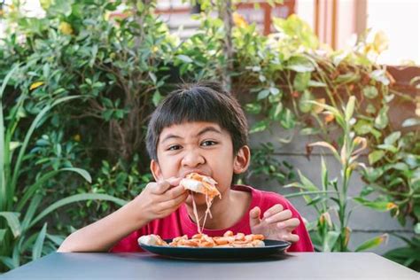 Kids Eating Pizza Stock Photos, Images and Backgrounds for Free Download