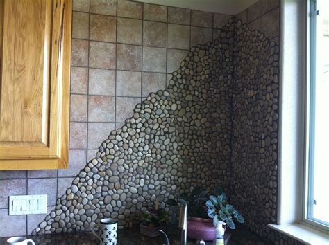 River rock pebbles to make this backsplash POP! Porcelain Tile, Ceramic Tiles, Rock Backsplash ...