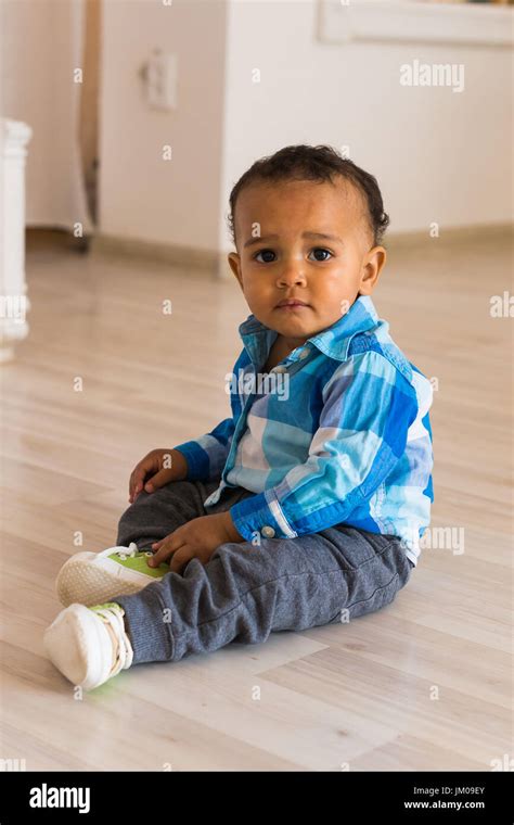 Cute little boy at home. Mixed race child Stock Photo - Alamy