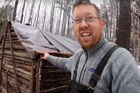 Dad spends year camping, building log cabin ‘survival shelter’ with young sons