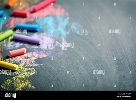 Colorful crayons on the blackboard, drawing. Back to school background ...