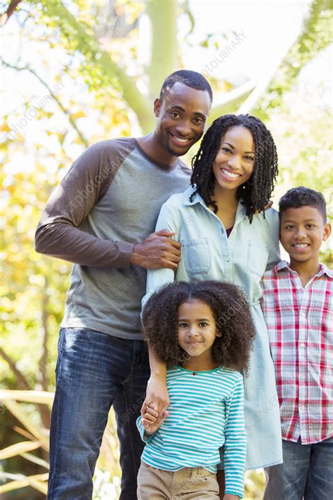 Portrait of smiling family outdoors - Stock Image - F014/5590 - Science Photo Library