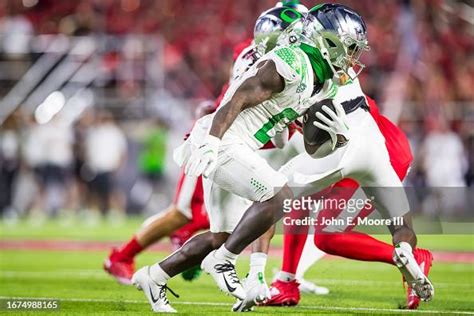 Bucky Irving of the Oregon Ducks runs the ball during the second half ...