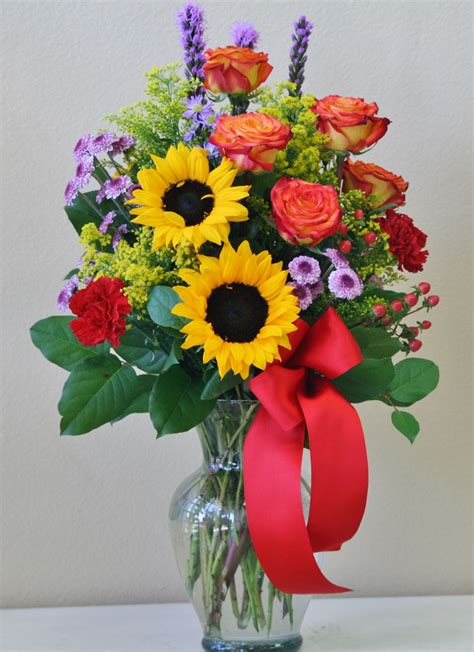 Orange roses, sunflowers, lavender buttons, red carnations, and more! #Riversi… | Flower ...