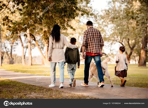 Family Walking In Park