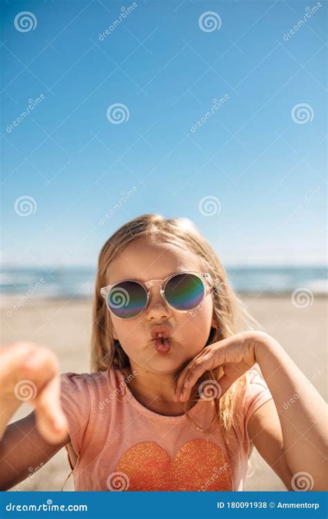 Cute Girl in Sunglasses Making a Funny Face Stock Photo - Image of facial, expression: 180091938