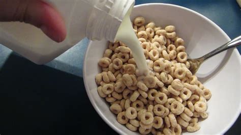 Milk Being Poured Onto Cereal. Stock Footage Video 3705008 - Shutterstock