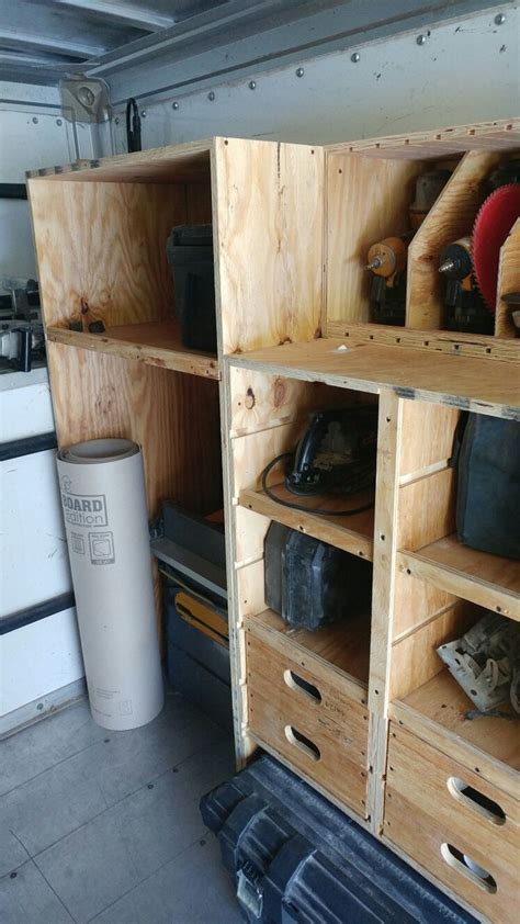 there are many wooden shelves in the garage