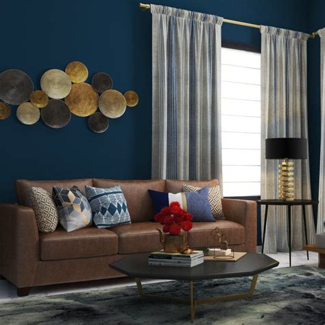 A navy blue wall matched with a classic brown sofa | Brown living room decor, Blue walls living ...