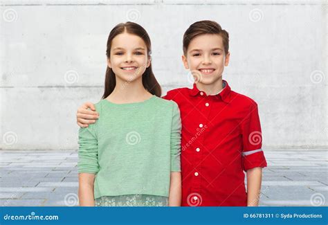 Happy Boy And Girl Hugging Stock Photo - Image: 66781311