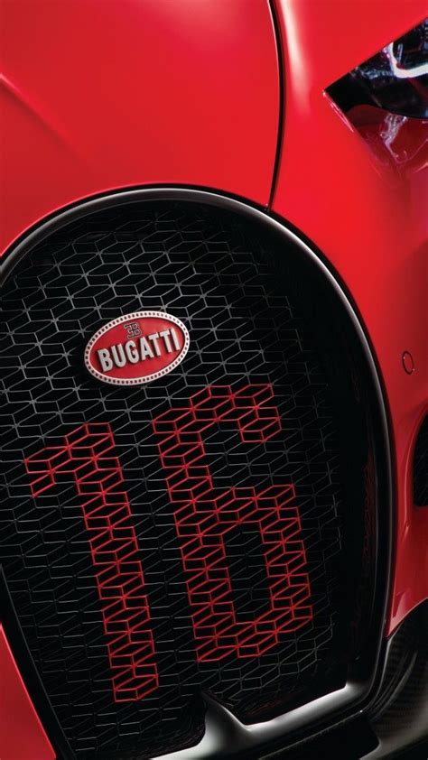 the front end of a red bugatti car with its grilles and numbers on it