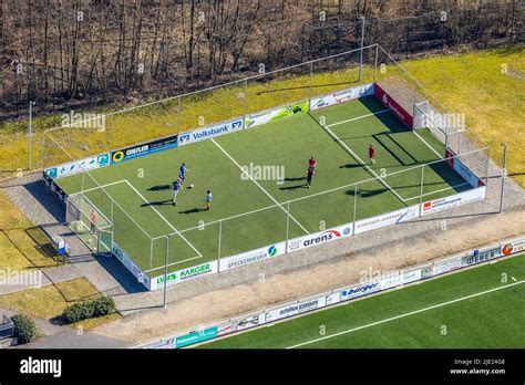 Aerial view, fenced football playground with youth players, Eslohe ...