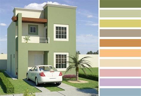 a woman is standing in front of a two story house with a car parked on the driveway