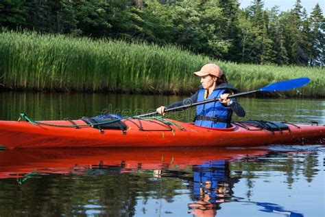 Woman Kayaking stock photo. Image of outdoor, nature - 27420642