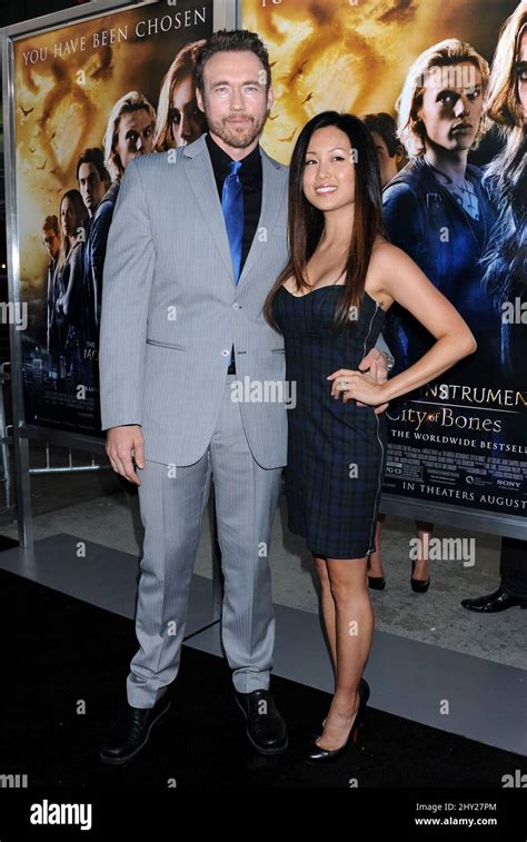 Kevin Durand and Sandra Cho attending the premiere of 'The Mortal Instruments: City of Bones ...