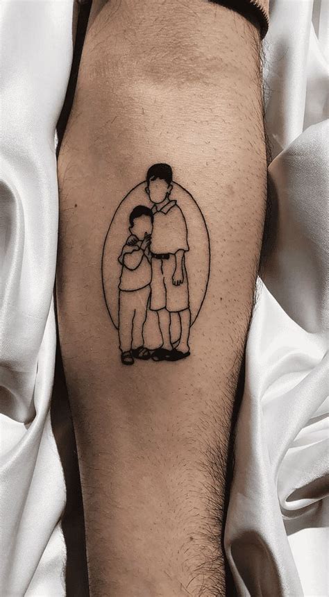 a man with a tattoo on his leg has a drawing of two people in the shape ...