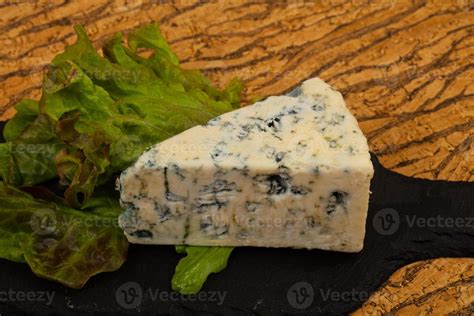 Blue cheese with salad leaves 8543236 Stock Photo at Vecteezy