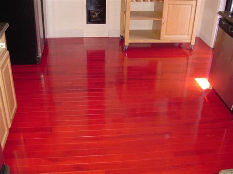 shiny-red-hardwood-floor-color-in-kitchen-area-equipped-with-cart ...