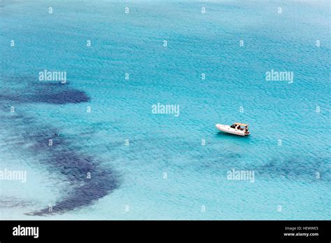 A small yacht in the lagoon Stock Photo - Alamy