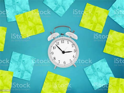 White Alarm Clock With Empty Green And Blue Note Paper Stickers Time Management Priorities ...