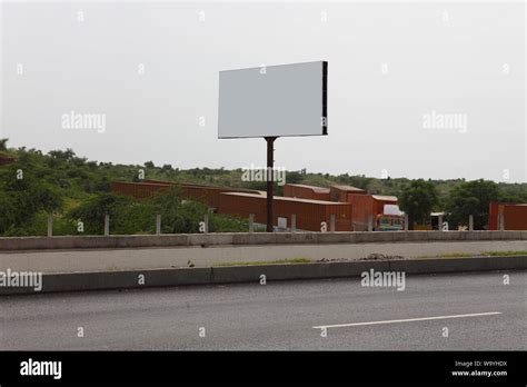 Blank billboard at roadside Stock Photo - Alamy