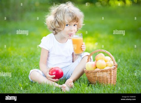 Child drinking apple juice Stock Photo - Alamy