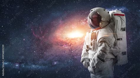 Surreal wallpaper with astronaut in space. Galaxy and stars. Spaceman ...