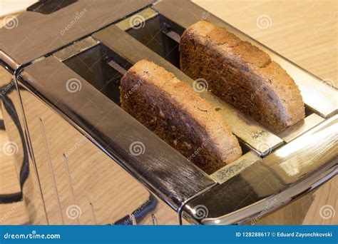 Toaster with toasted bread stock image. Image of electrical - 128288617