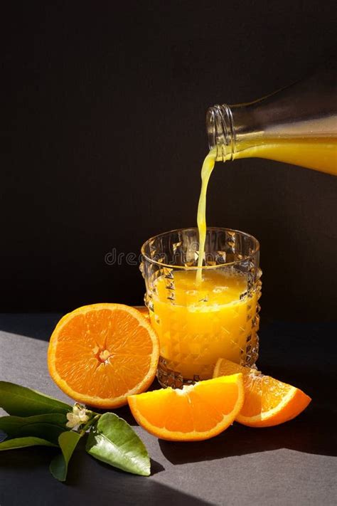 Orange Juice Pouring in the Glass from Bottle Stock Image - Image of ...