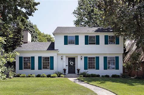 Curb Appeal Upgrade: Transform Your Home with a White Painted Brick House and Stylish Shutters