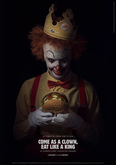 the clown is holding a burger in his hands