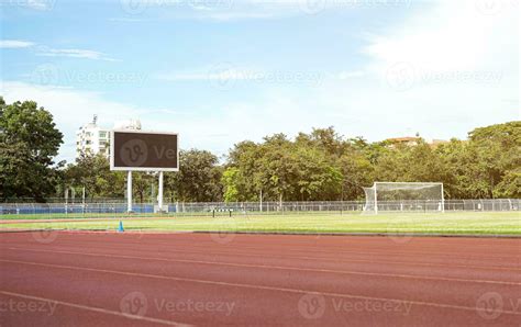 Scene of football field with scoreboard and bright blue sky. 30084581 Stock Photo at Vecteezy