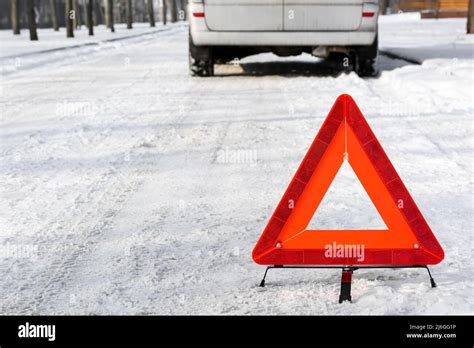 Emergency stop sign and broken car on snowy winter day Stock Photo - Alamy