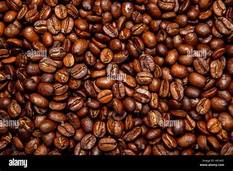 roasted coffee beans background Stock Photo - Alamy