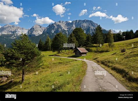 Germany, Bavaria, Mittenwald, Hiking trail with Karwendel mountains in ...