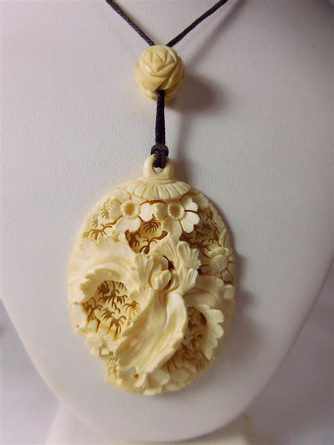 Antique 3" Carved Pre- Ban Ivory Iris Pendant